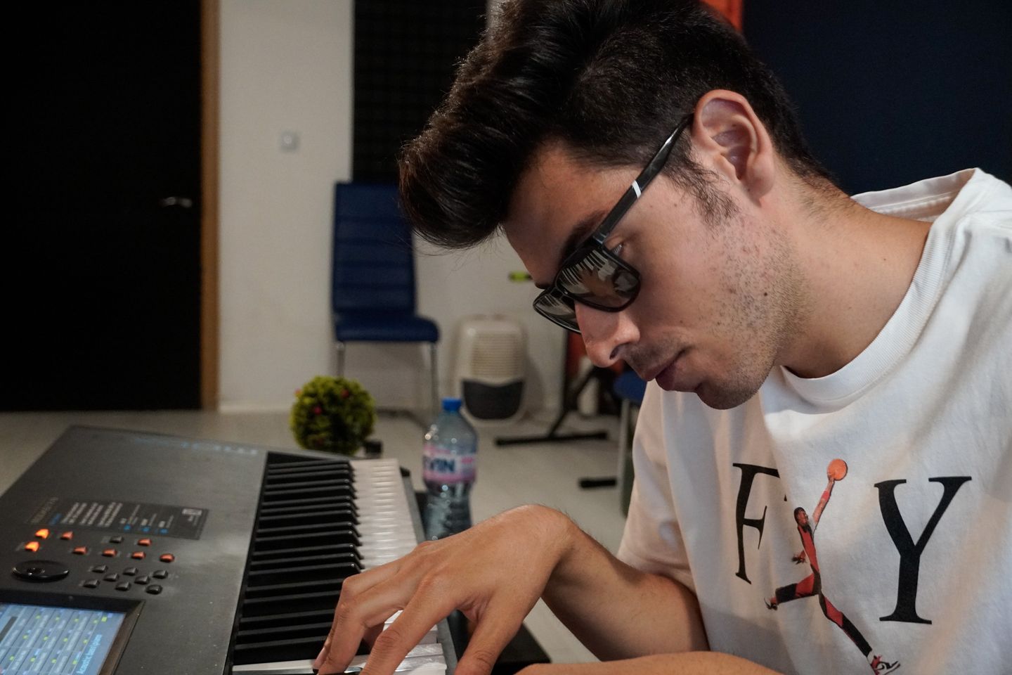 Viktor Nikolov performing on a stage keyboard.