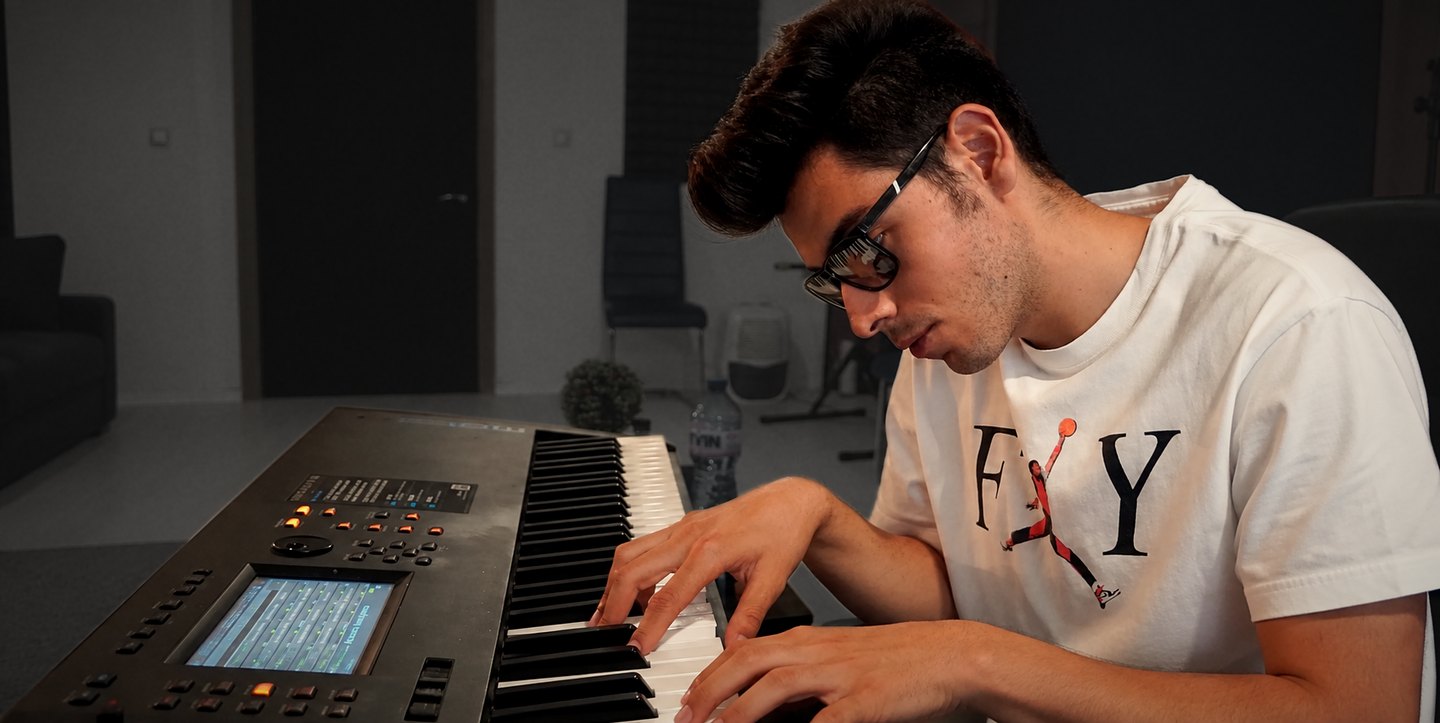 Viktor Nikolov at the keyboard in his studio.
